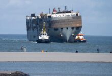 Carnival ship being towed to s d