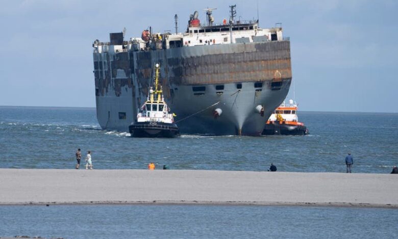 Carnival ship being towed to s d