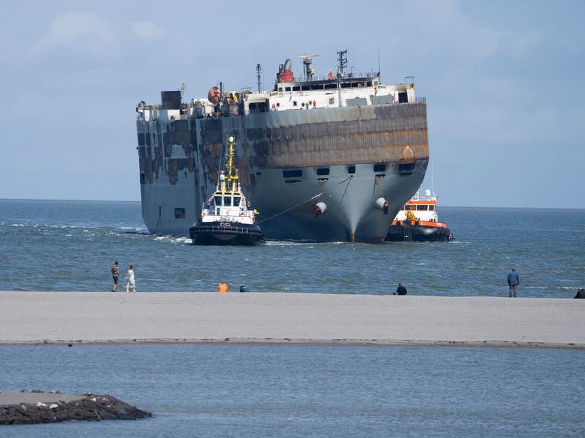 Carnival ship being towed to s d