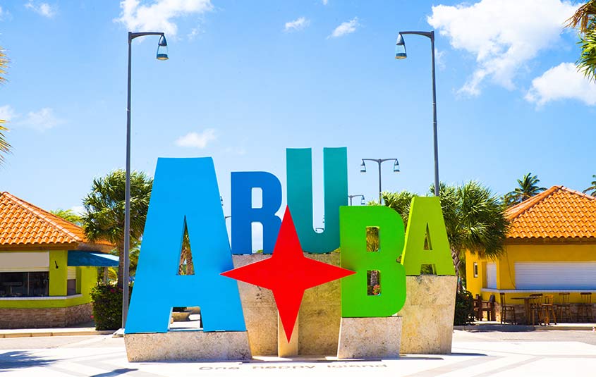 Aruba tourism honor authority loyal visitors island